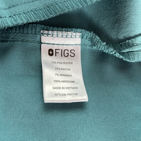 FIGS v-neck short sleeve two front pocket scrub shirt in a blue green color - Picture 12 of 16